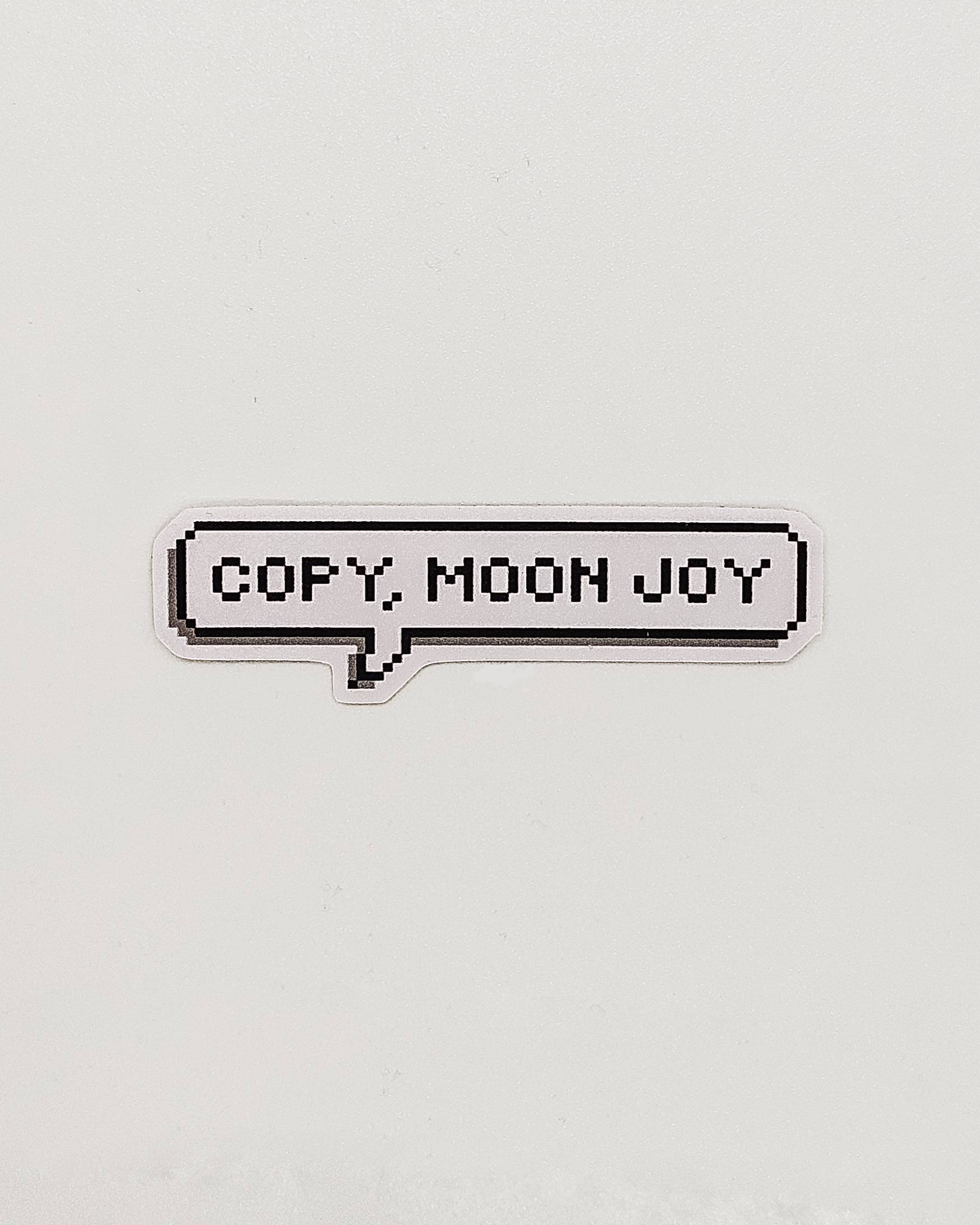 Pixel text 'COPY MOON JOY' on a light gray background