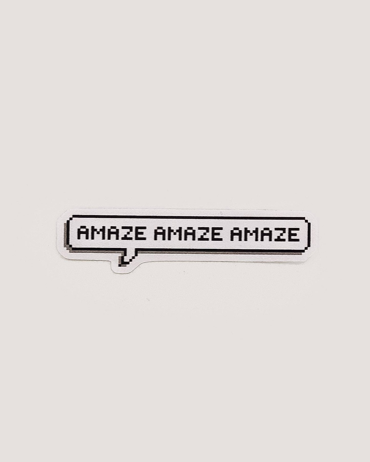 Pixel text 'AMAZE AMAZE AMAZE' in a speech bubble on a white background